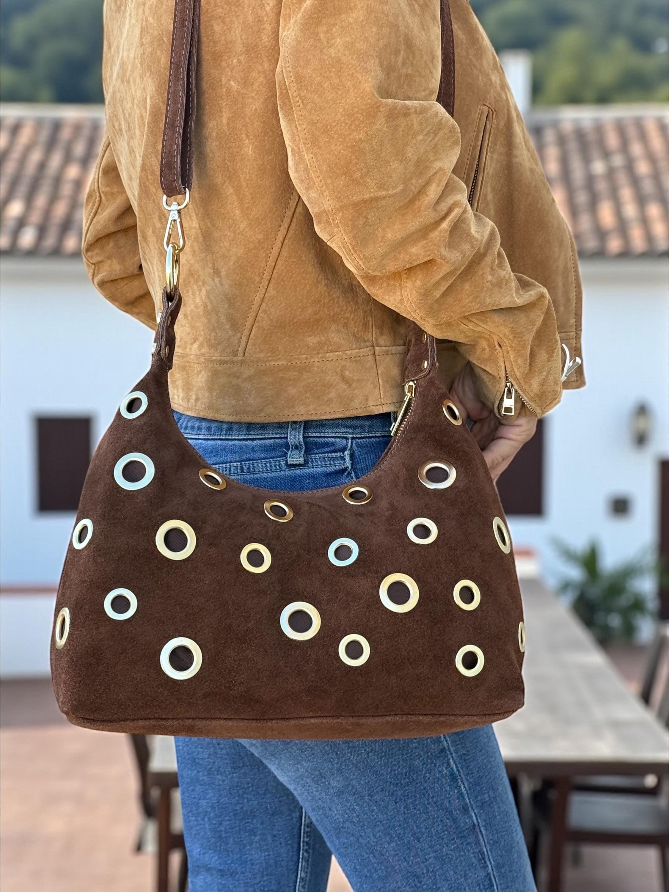 Suede crossbody with gold eyelets