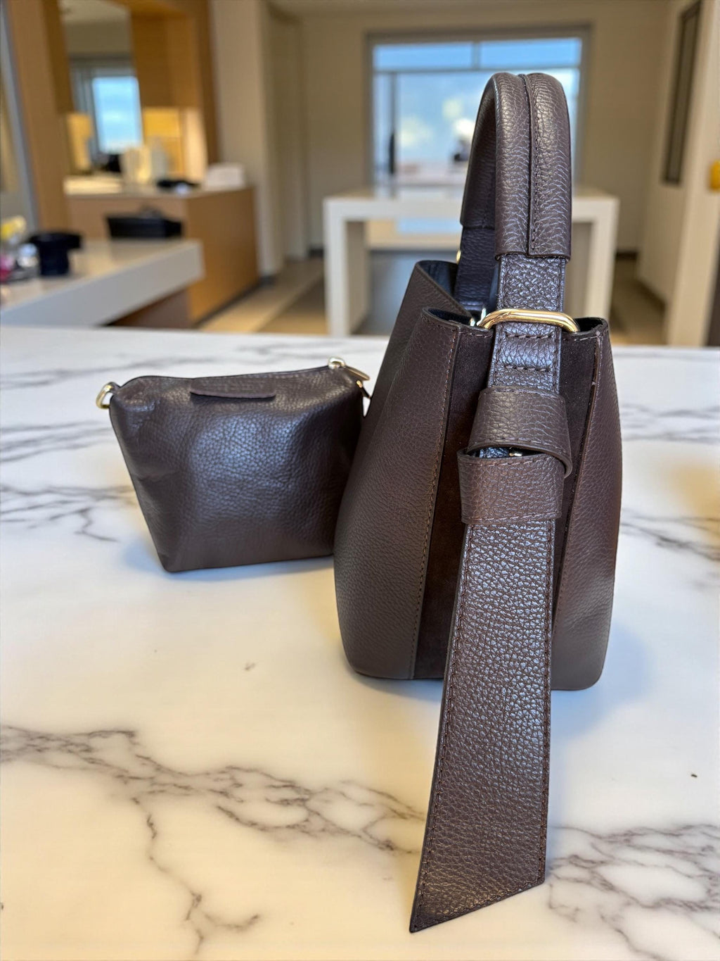 Removable organizer pouch for a mini leather shoulder bag