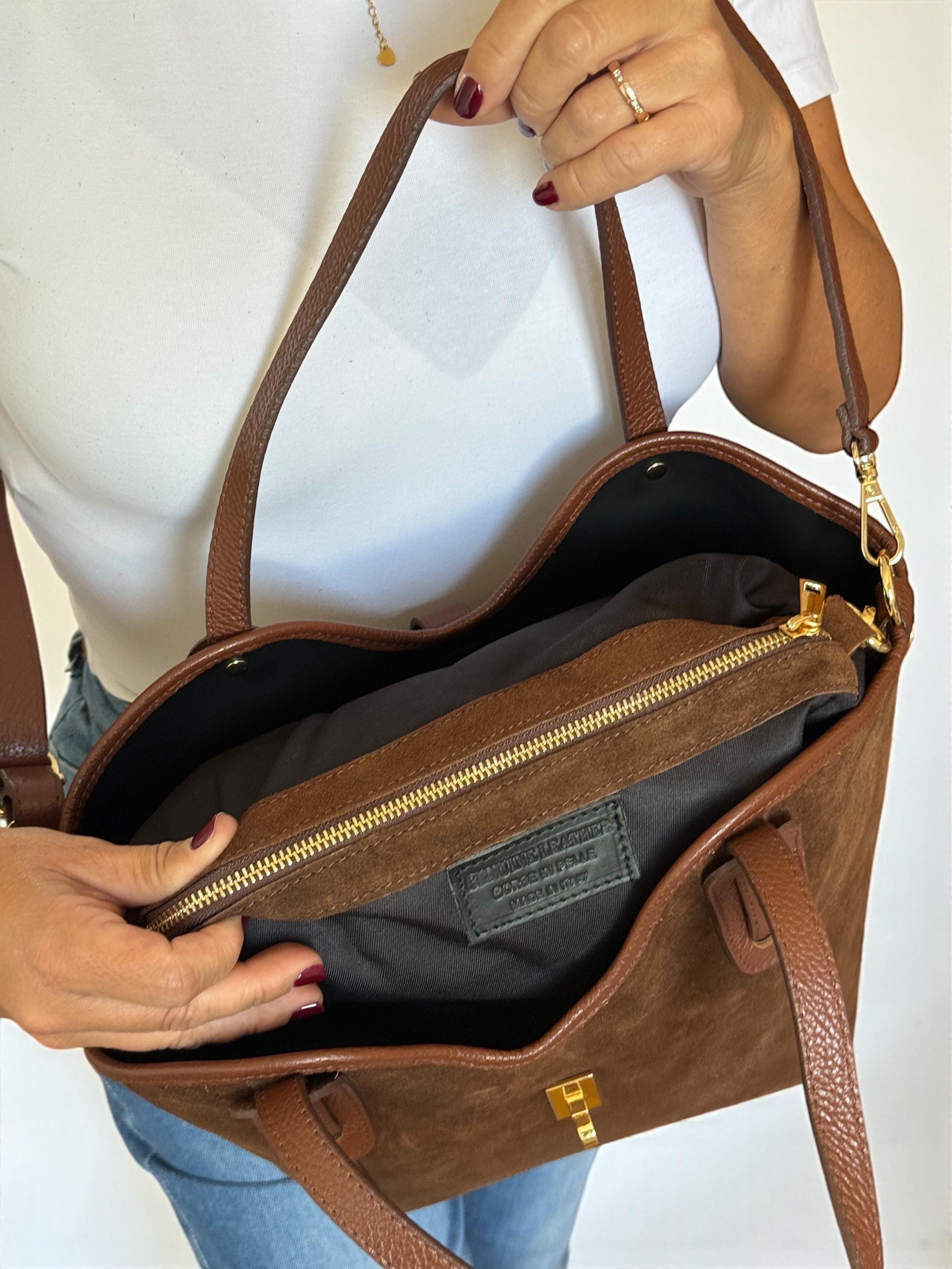 Leather-lined interior of a structured designer tote bag