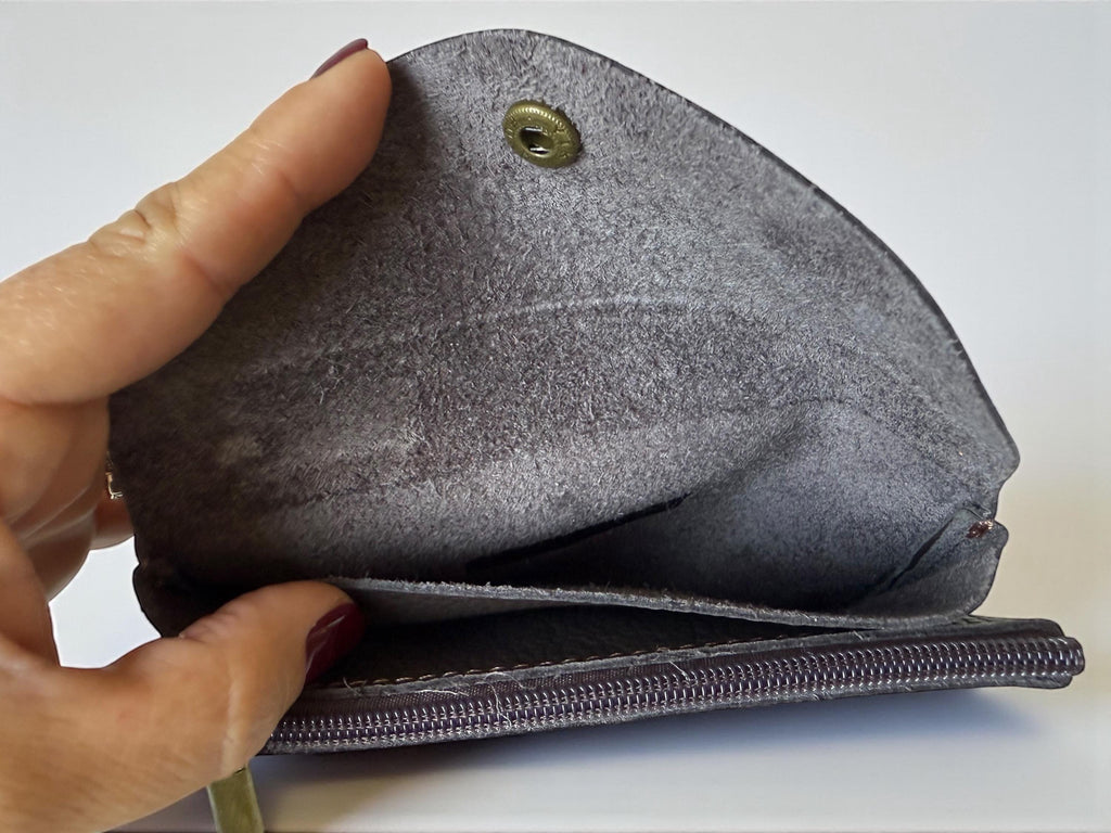 Interior view of the leather wallet showing card pockets and zippered coin section