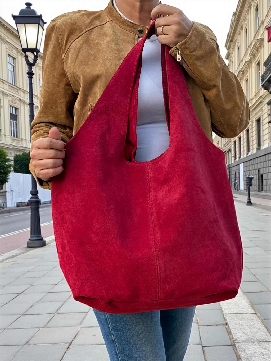 Oversized Red Suede boho Tote bag – University or office bag being carried on a city street.