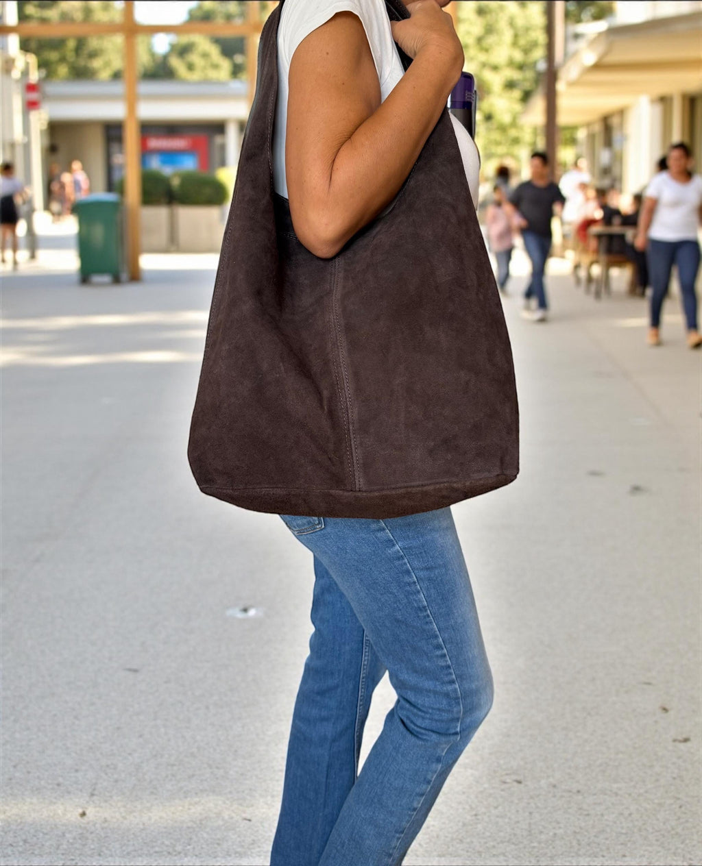 Close-up of visible stitching on premium chocolate Italian suede Paloma Palomo
