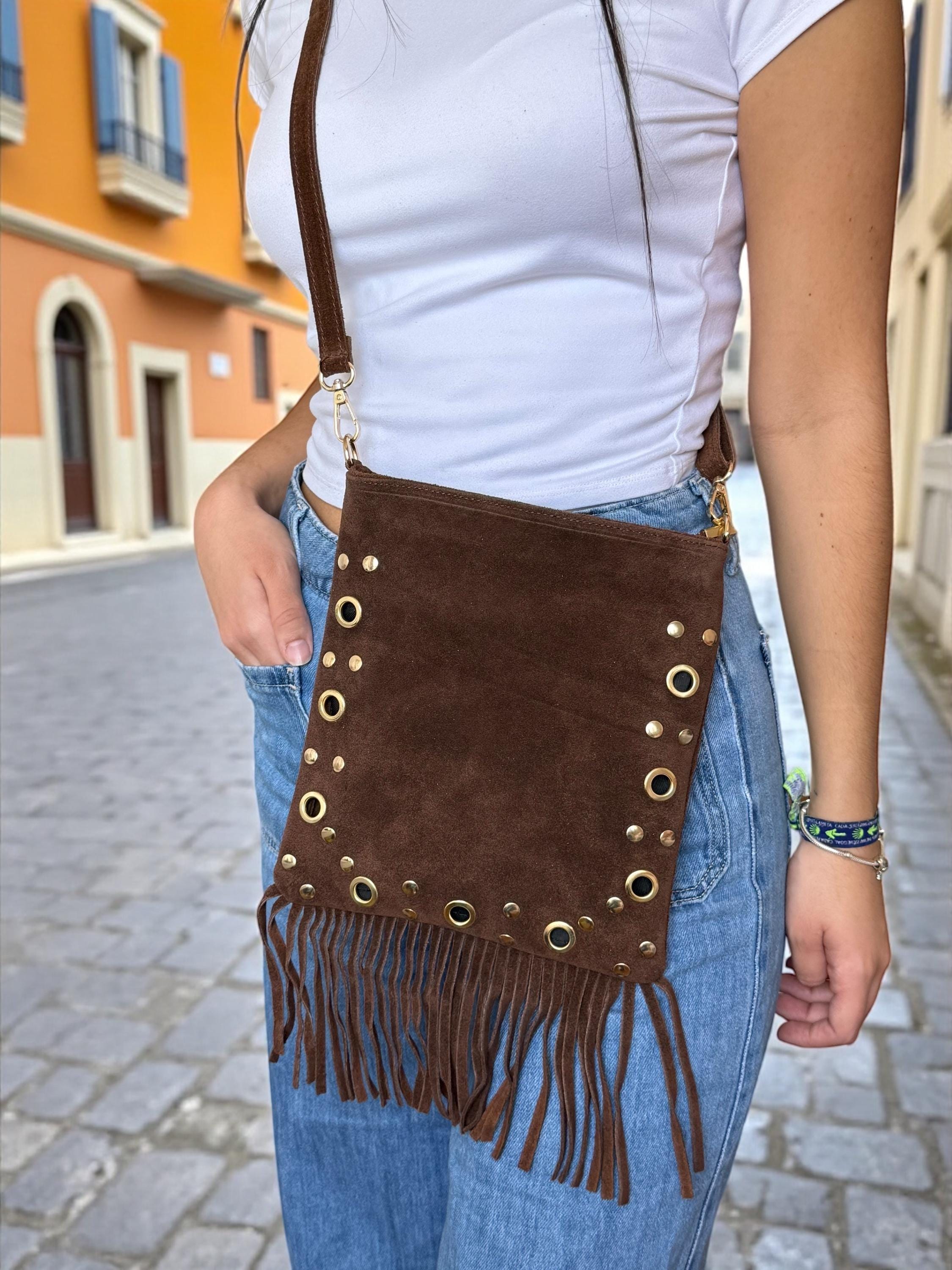 A suede fringe crossbody bag with a playful, boho-chic look