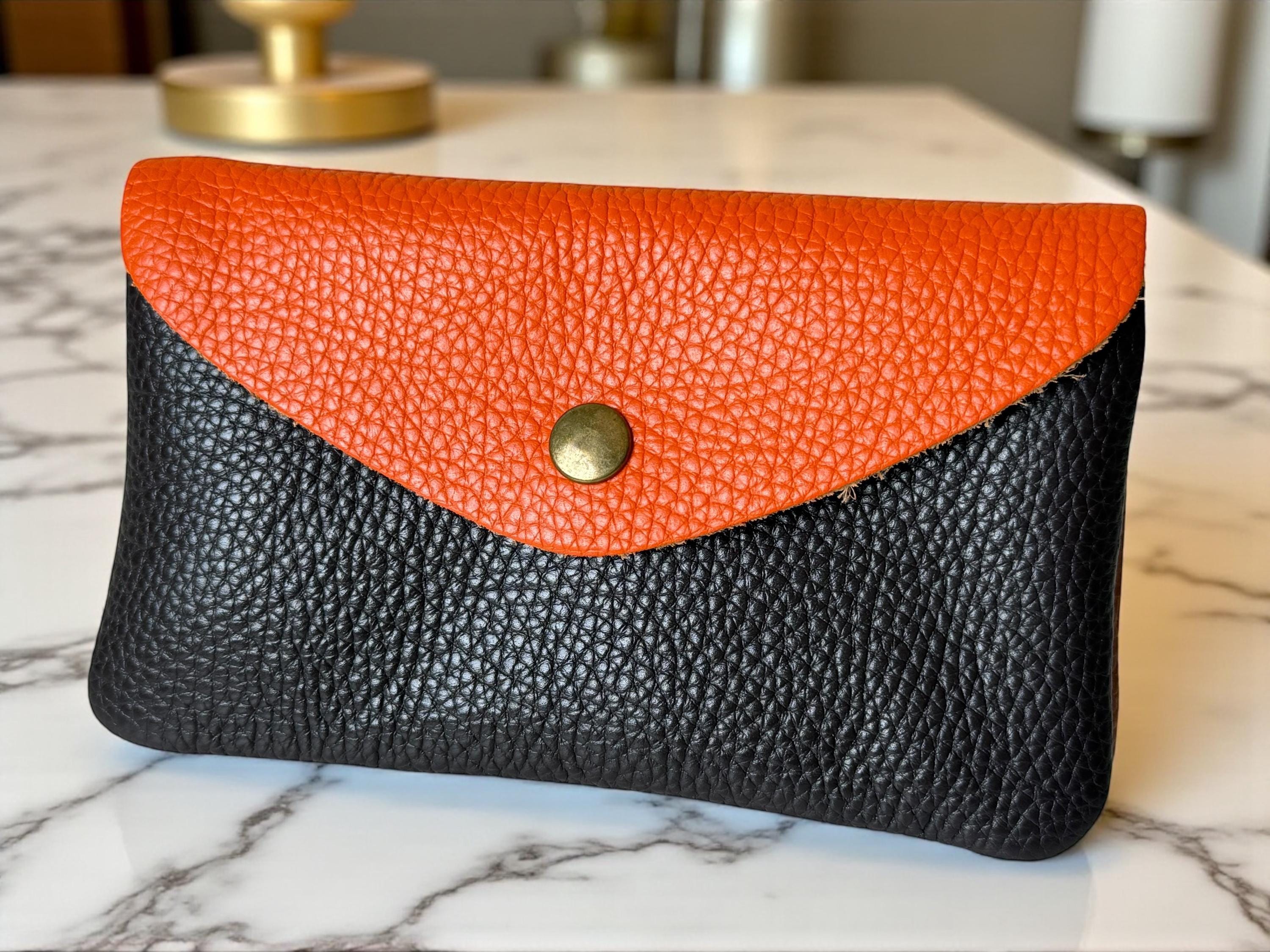 Close-up of two-tone pebbled leather texture on a handcrafted designer wallet