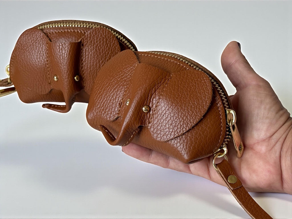 Close-up of stitched elephant ears and trunk detail on a leather animal accessory