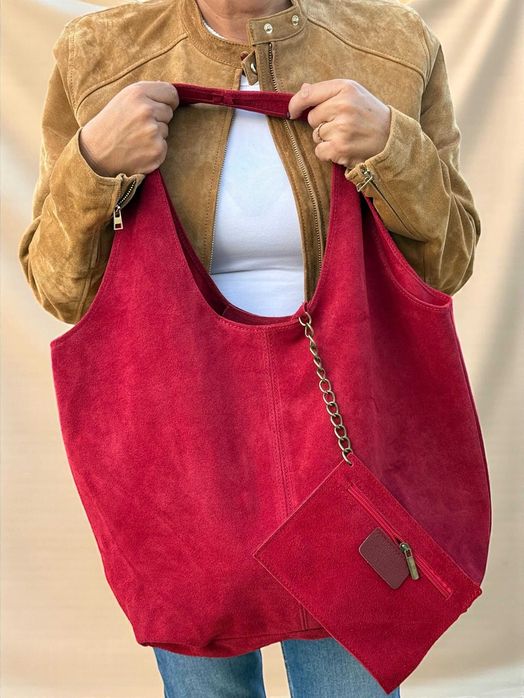 Internal suede pocket in a red oversized tote bag