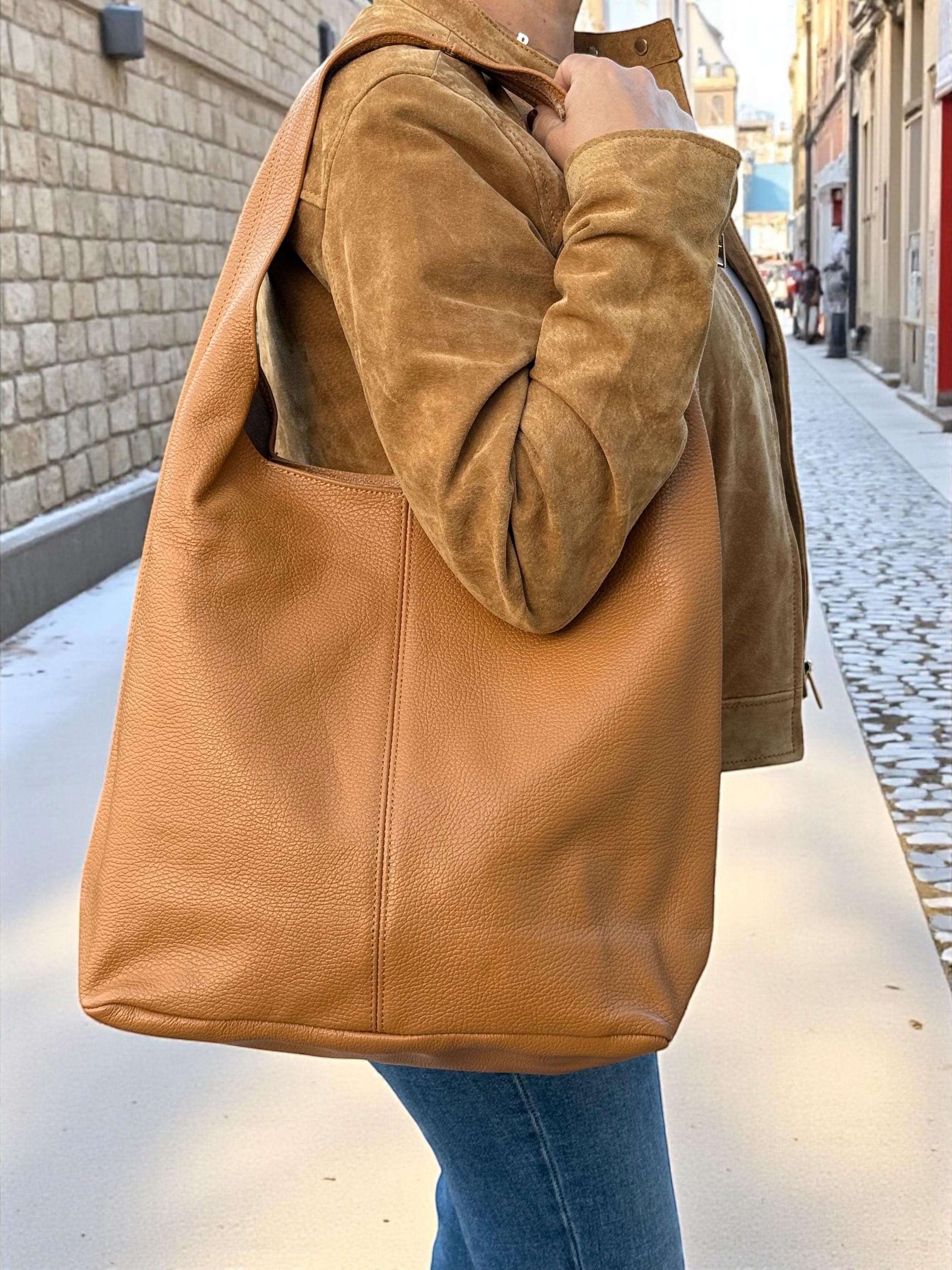 Front view of a Paloma Palomo Italian pebbled leather tote bag in Camel Brown with minimalist design. Paloma Palomo