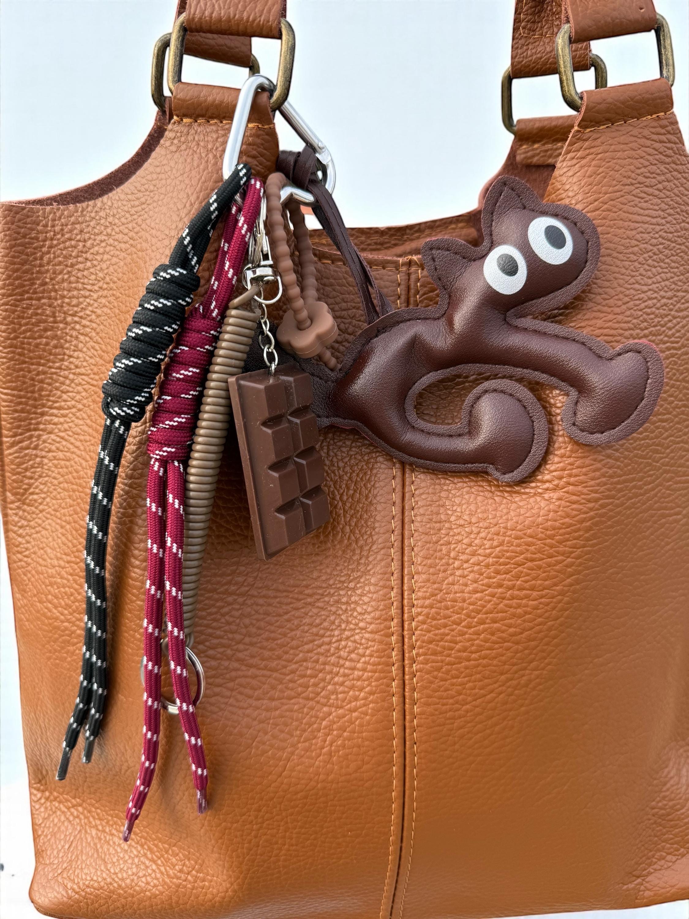 Leather tote bag with charm